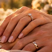 Priya and James’s hands with wedding rings